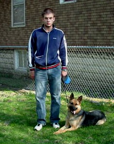 Personal Protection Dog ROXY laying beside his proud and satisfied owner