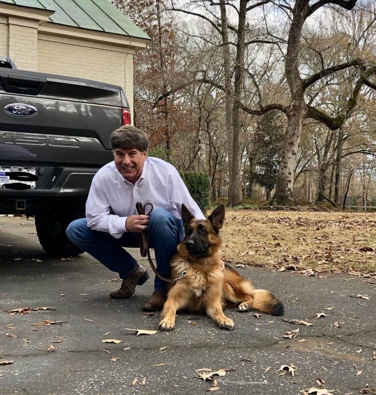 European German Shepherd with his proud owner