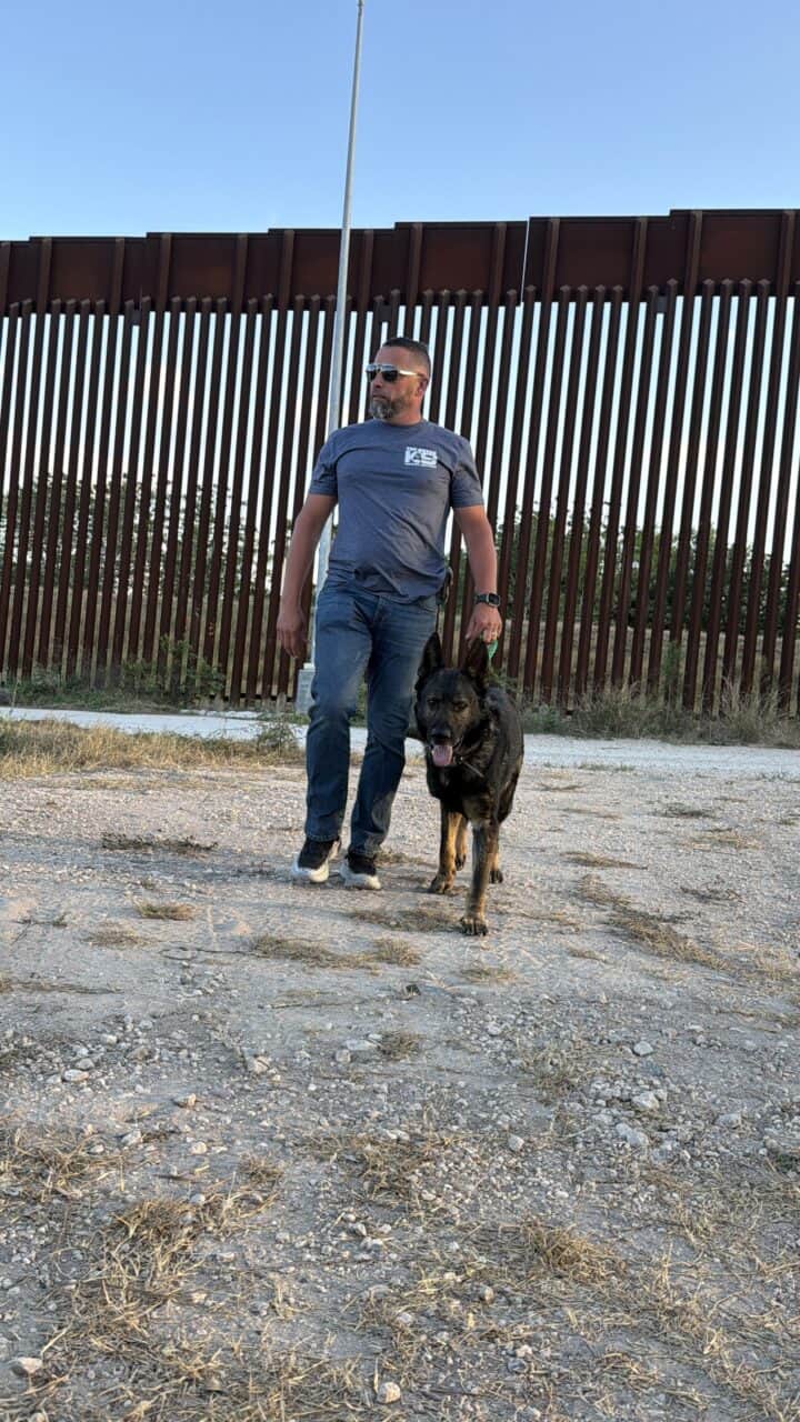 Executive with protection dog